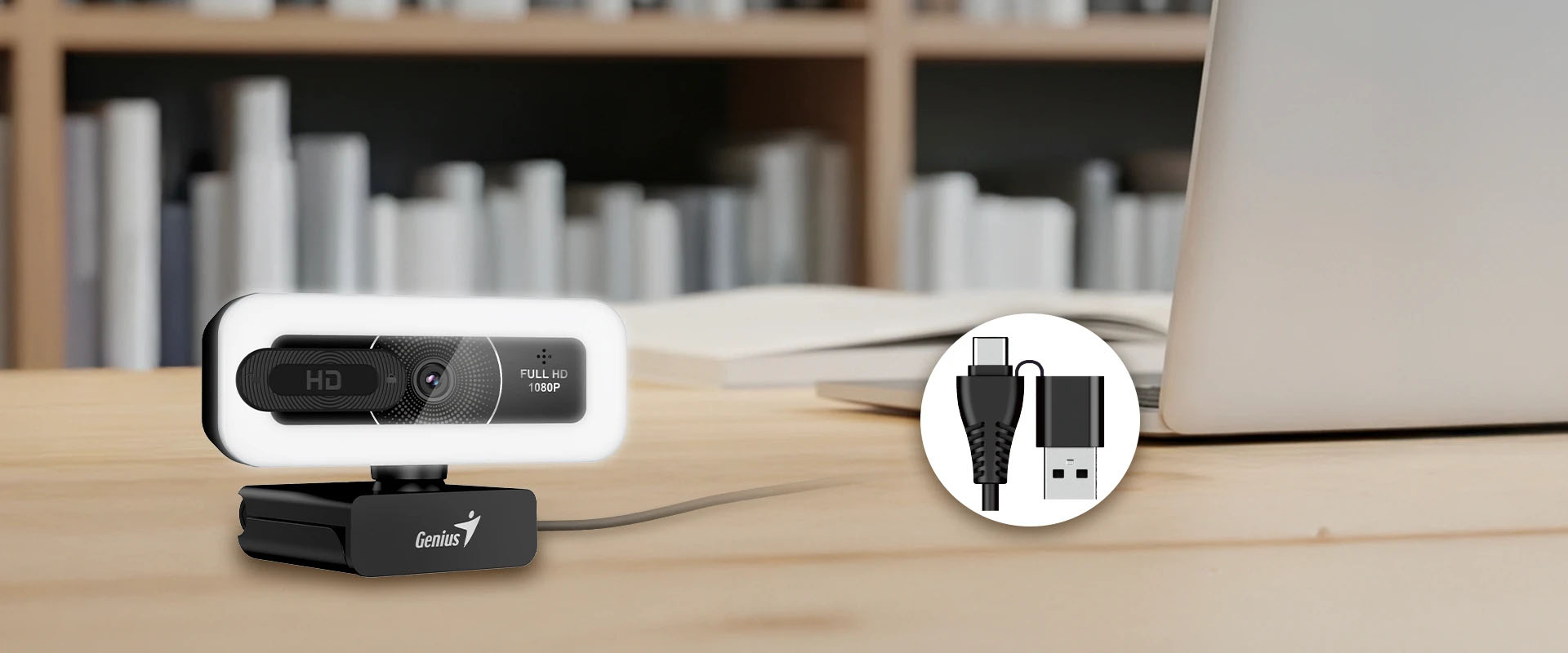 Webcam Genius FaceCam LIGHT Full HD 1080P sobre un escritorio con cable USB-A y USB-C junto a una notebook