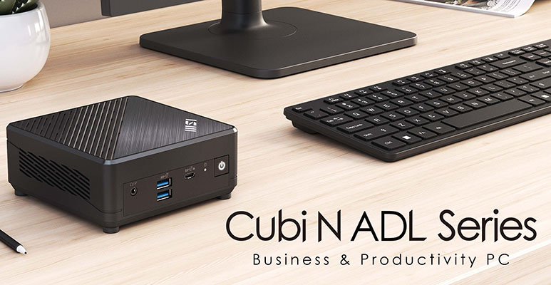 Mini PC MSI Cubi N ADL sobre un escritorio junto a un monitor y teclado