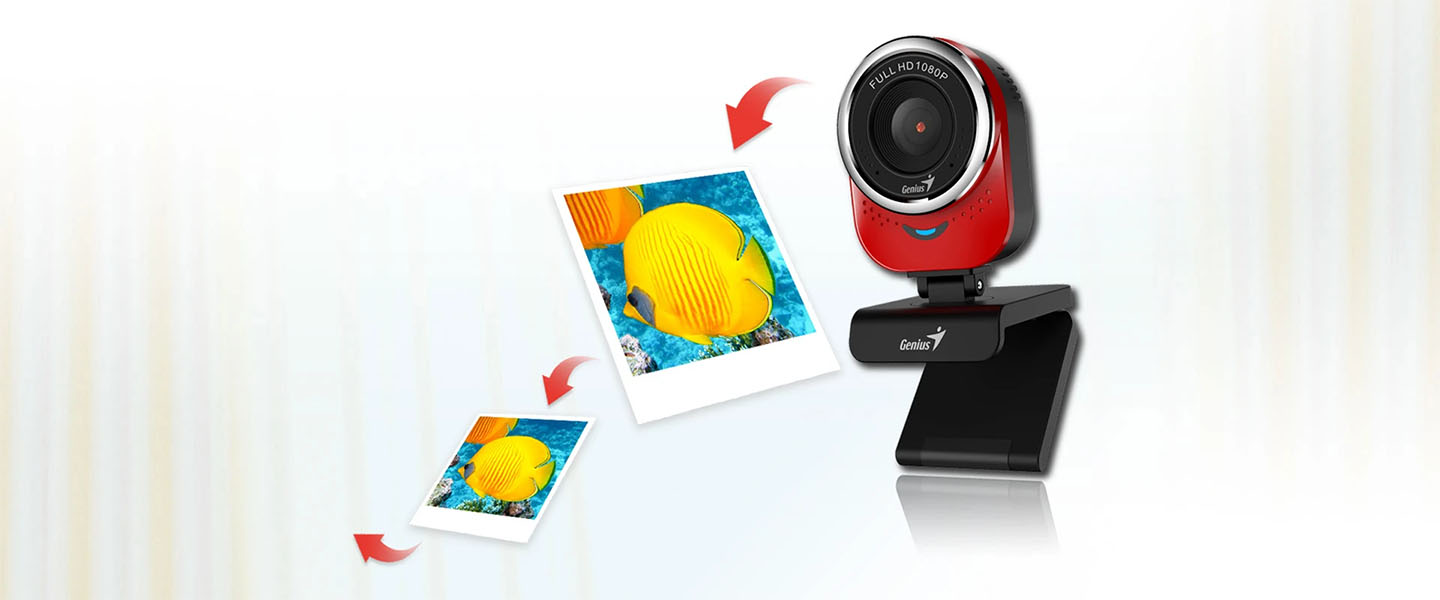 Webcam Genius QCam 6000 de color rojo y negro, mostrando flechas rojas curvas indicando una imagen en alta resolución de un pez mariposa amarillo.