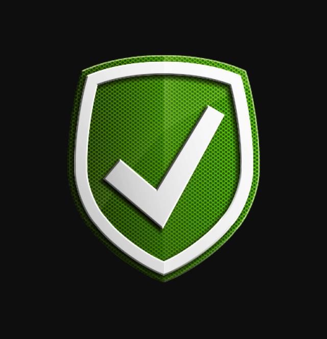 Esta imagen muestra un escudo verde con un borde blanco y un gran símbolo de verificación blanco en el centro. El fondo es negro, lo que hace que el escudo y el símbolo de verificación resalten.