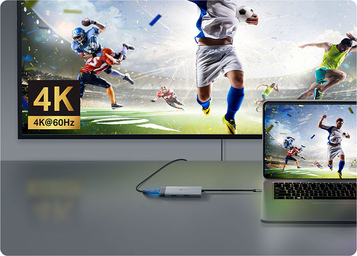 Notebook conectada a un televisor 4K mediante un Hub USB-C 5 en 1 TP-Link UH5020C, mostrando contenido deportivo en resolución 4K a 60Hz.