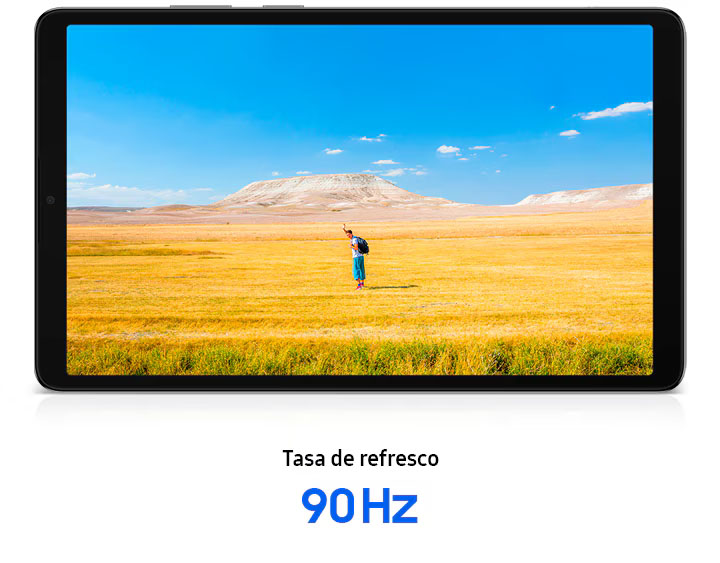 La Galaxy Tab A11 está colocada en posición horizontal, mostrando con claridad la imagen de un hombre saludando con las manos, transmitiendo una sensación de libertad. De fondo, se extiende un cielo azul sobre un amplio horizonte de pasto amarillo y marrón. Debajo de la tablet, se lee el texto: Tasa de refresco 90 Hz.