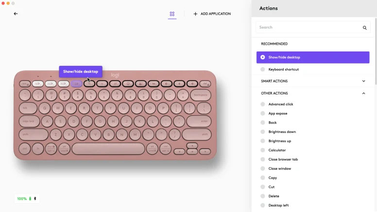 Una ventana de configuración del software Logi Options+ para personalizar el teclado Logitech Pebble Keys 2 K380s rosado, mostrando la opción Ocultar/mostrar escritorio seleccionada para la tecla F4.