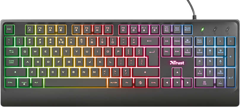 Teclado Trust Ziva con retroiluminación RGB. El teclado muestra una distribución completa de teclas, incluyendo un teclado numérico a la derecha. Las teclas están iluminadas con colores que varían desde el verde en la parte izquierda, pasando por el amarillo y el naranja en el centro, hasta el rosa y el azul en la parte derecha. Las teclas de función (F1-F12) están en la parte superior, y hay indicadores LED para Bloq Num, Bloq Mayús y Bloq Despl.